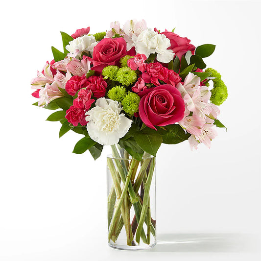 A comforting get well flower vase filled with soft, pastel flowers like lilies, daisies, and roses, offering a warm and cheerful gesture of support for someone in recovery.
