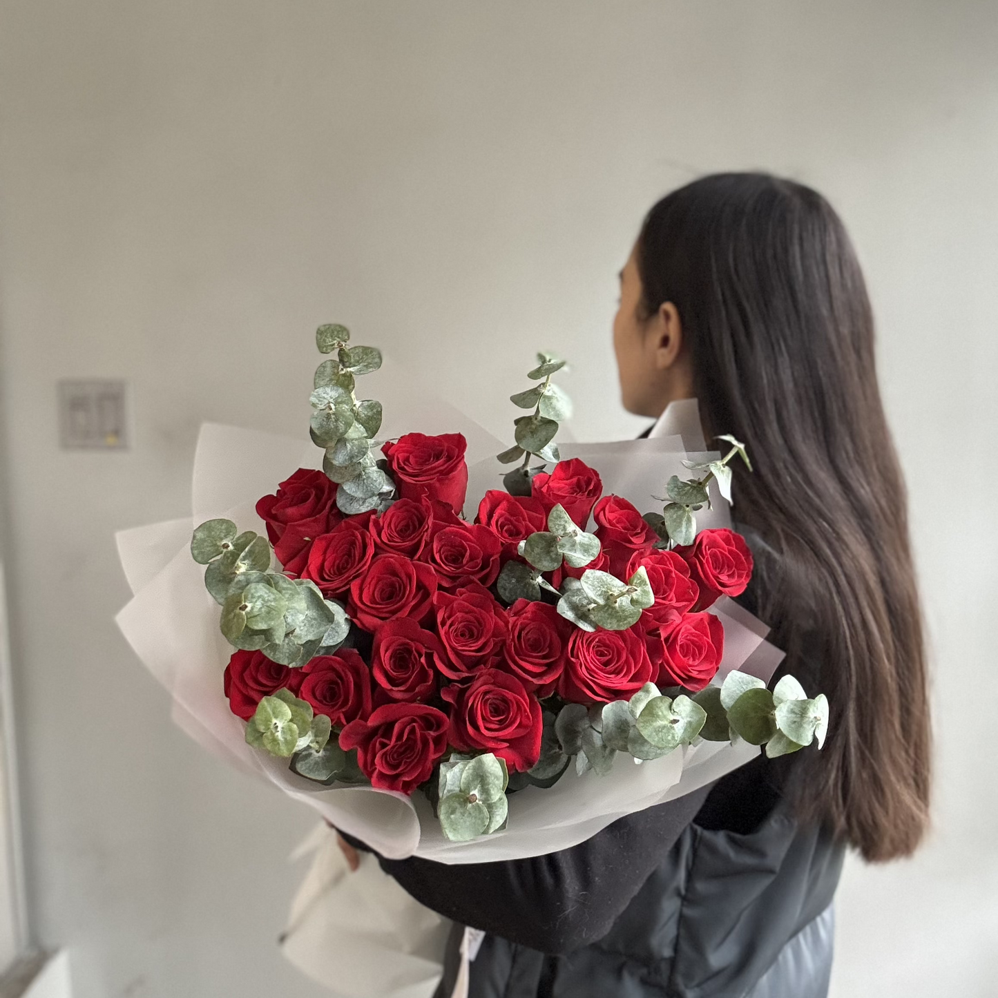 A Red Flames Rose Bouquet featuring deep red and fiery orange roses, arranged to create a dramatic, passionate floral display symbolizing love and desire.