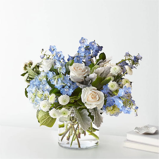 A cheerful happy retirement vase filled with vibrant flowers like sunflowers, lilies, and roses, celebrating a new chapter with joy and bright colors.