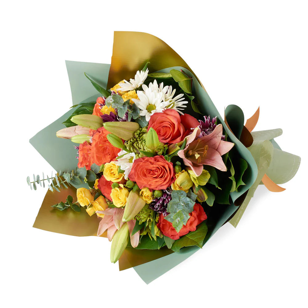 A stunning mixed bouquet of lilies and roses in vibrant hues, blending elegance and fragrance to create a romantic and timeless floral arrangement.