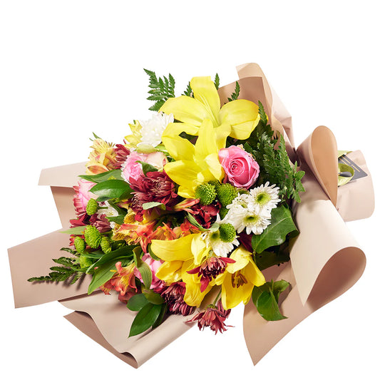  A beautiful Lilies Mix Bouquet featuring a variety of colorful lilies in shades of white, pink, orange, and yellow, arranged with lush greenery for an elegant and fragrant display.
